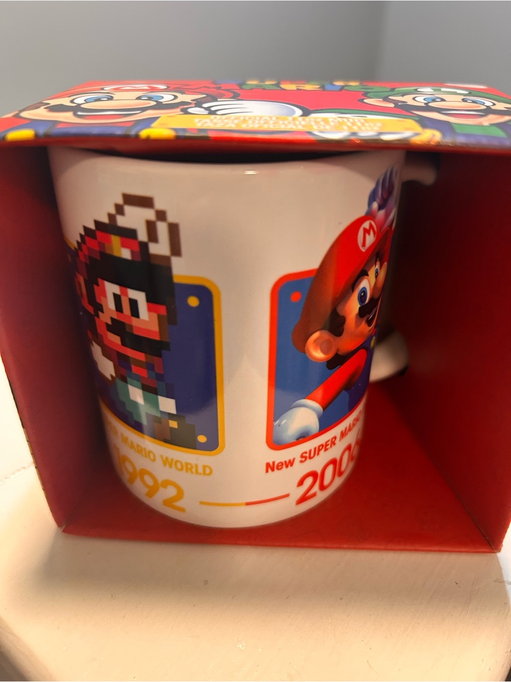 Nintendo Mario Anniversary Mug - White with Red, Blue & Yellow Art